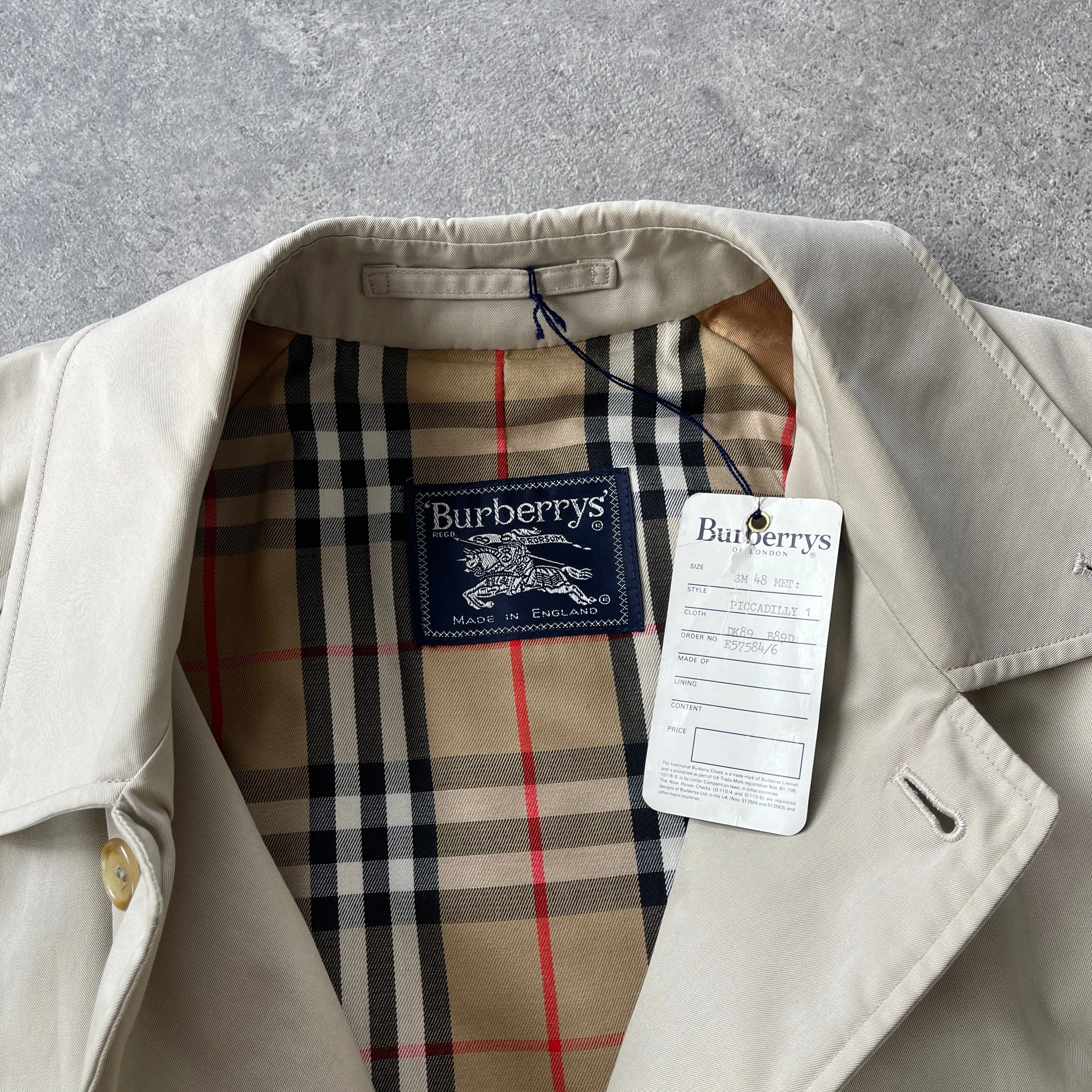 Burberry’s 1990s nova check cream trench jacket (M)